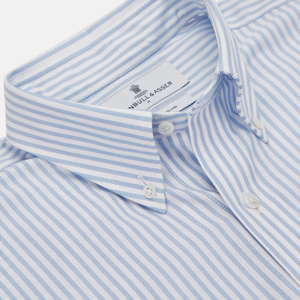 The Turnbull & Asser Blue and White Fine Stripe Oxford Weekend Fit Shirt features a Dorset collar and 1-button cuffs, shown laid flat on a white background. Part of our Weekend Fit shirts collection.