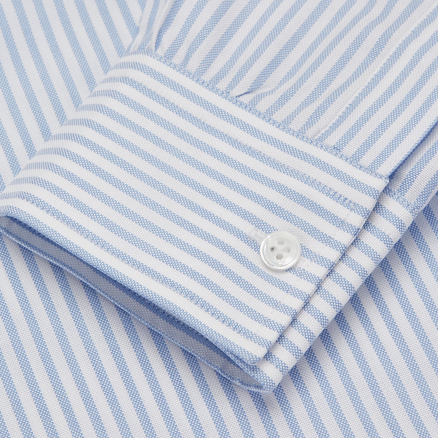 View 3 of product The Turnbull & Asser Blue and White Fine Stripe Oxford Weekend Fit Shirt features a Dorset collar and 1-button cuffs, shown laid flat on a white background. Part of our Weekend Fit shirts collection.