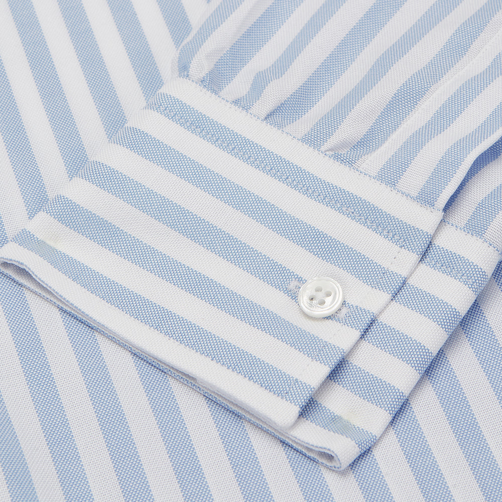 The Turnbull & Asser Blue and White Bengal Stripe Oxford Weekend Fit Shirt features a Dorset collar and 1-button cuffs, shown laid flat on a white background.