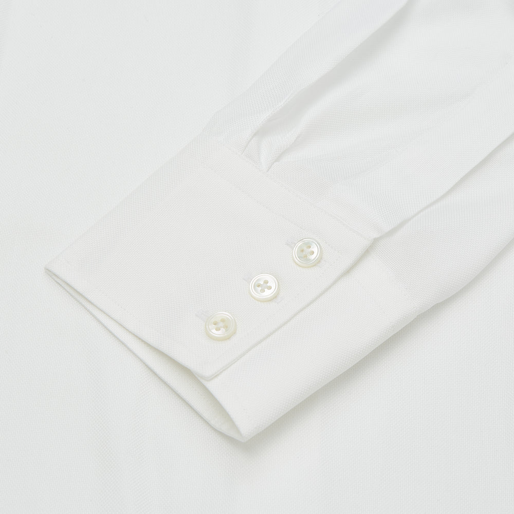 Turnbull & Asser’s Plain White Oxford Tailored Fit Cotton Shirt features a Bury collar and 3-button cuffs—an elegant classic for timeless, minimalist style.