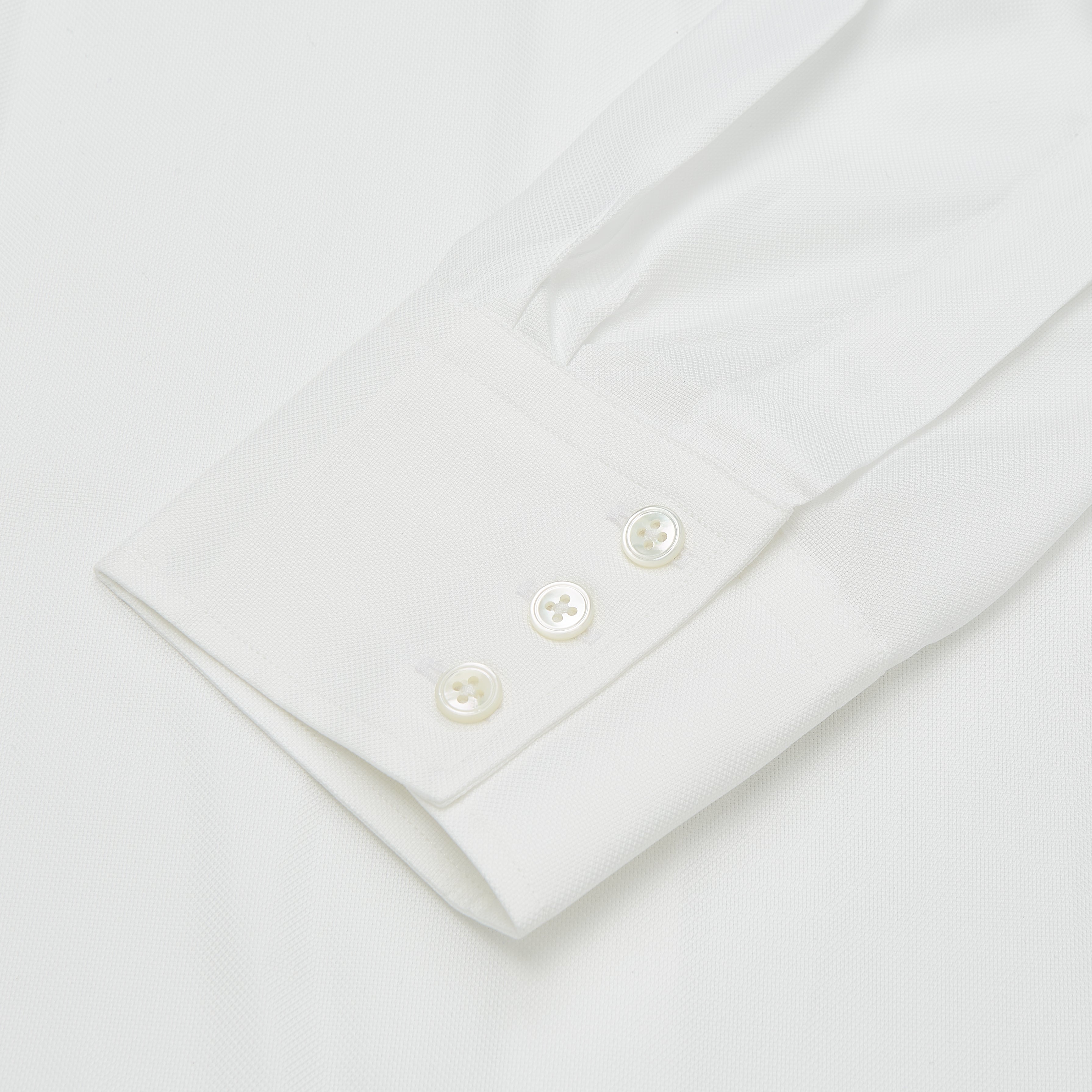 View 2 of product Turnbull & Asser’s Plain White Oxford Tailored Fit Cotton Shirt features a Bury collar and 3-button cuffs—an elegant classic for timeless, minimalist style.