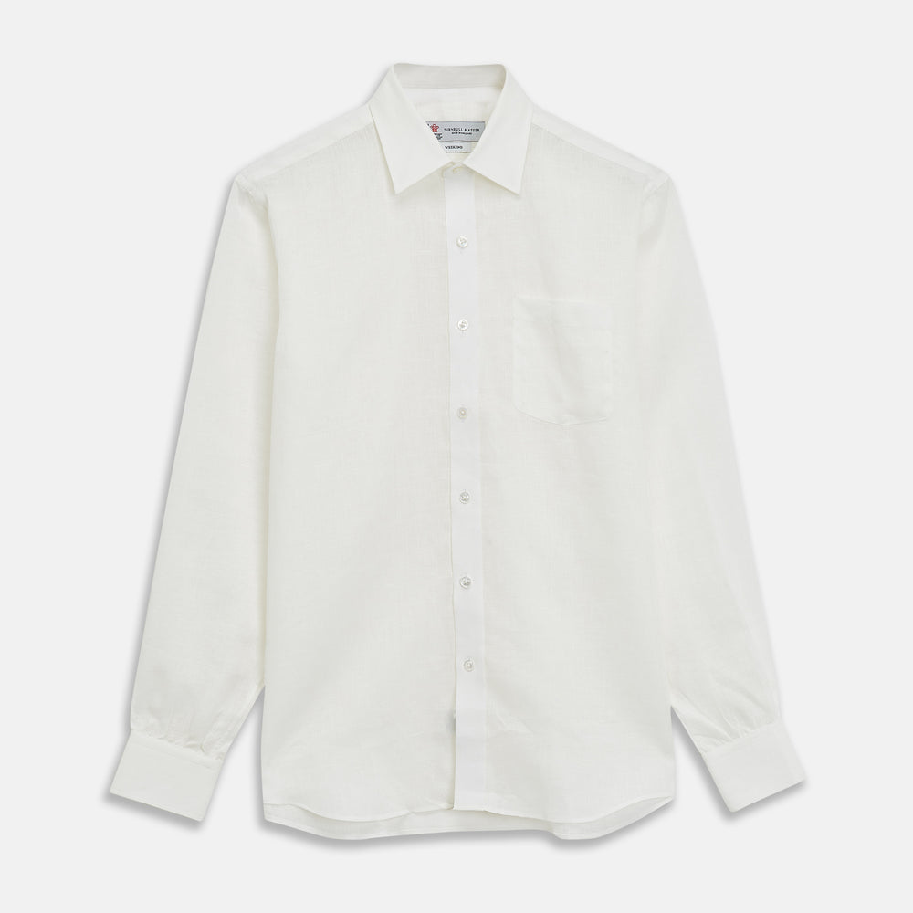The Turnbull & Asser Cream Linen Weekend Fit Shirt features a Derby collar, 1-button cuffs, and single chest pocket, crafted from sustainable French linen. Shown laid flat on a white background.