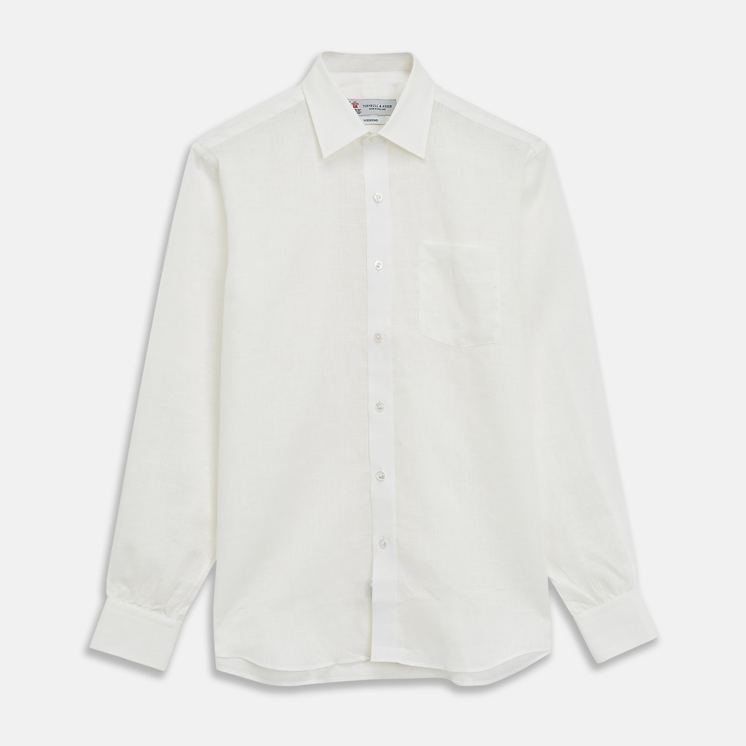 View 1 of product The Turnbull & Asser Cream Linen Weekend Fit Shirt features a Derby collar, 1-button cuffs, and single chest pocket, crafted from sustainable French linen. Shown laid flat on a white background.