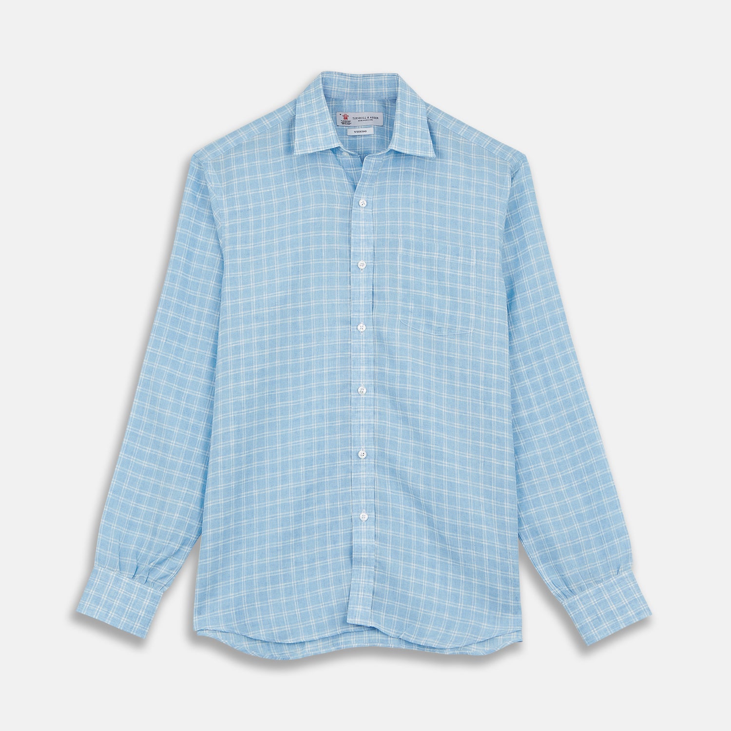 View 1 of product The Turnbull & Asser Weekend Fit Blue Plaid Linen Shirt features a white check pattern, Derby collar, long sleeves with 1-button cuffs, single chest pocket, and button-up front, shown against a white background.
