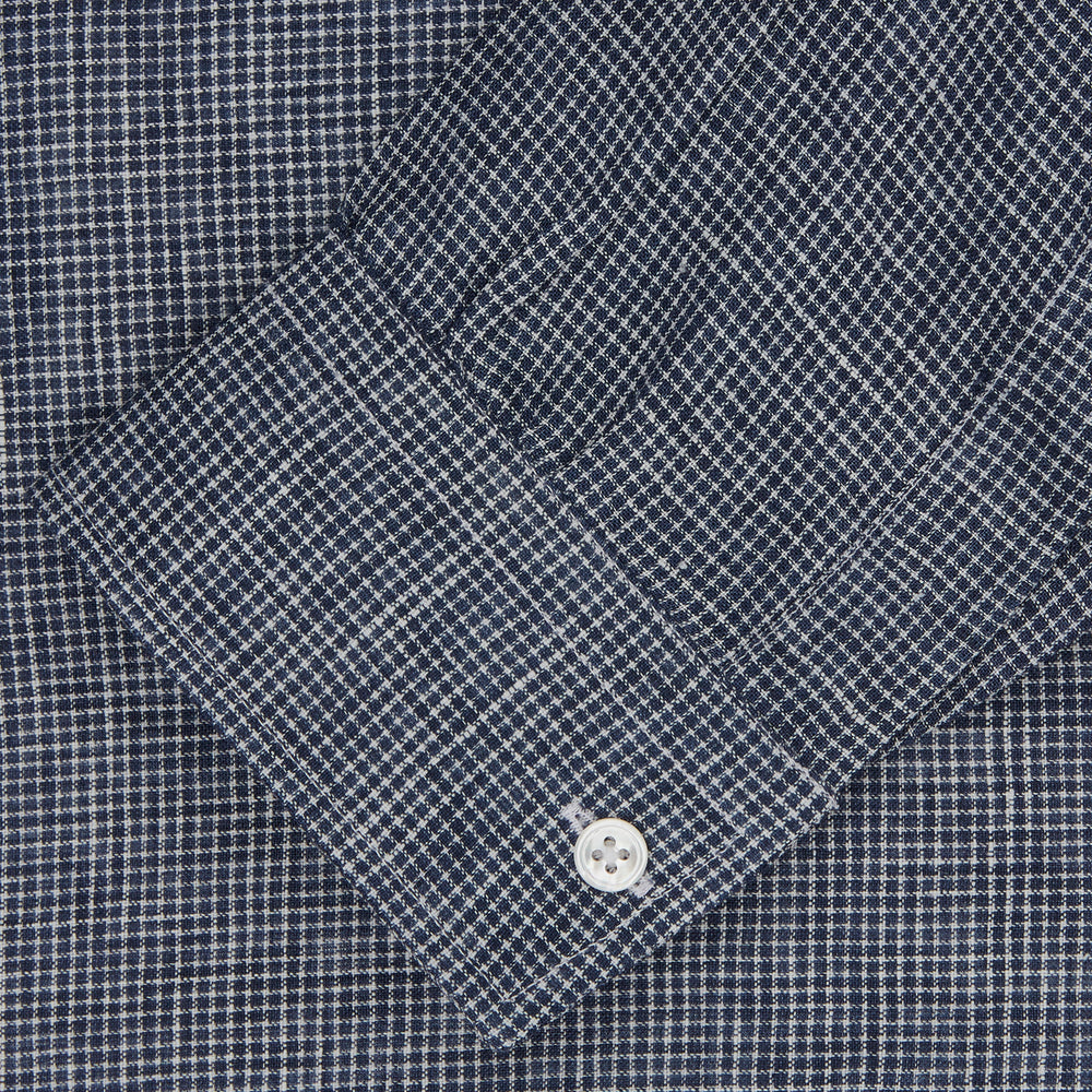 The Turnbull & Asser Weekend Fit Navy Check Linen Shirt features a Derby collar, left chest pocket, 1-button cuffs, and white buttons in textured microcheck fabric, shown laid flat on a white background.