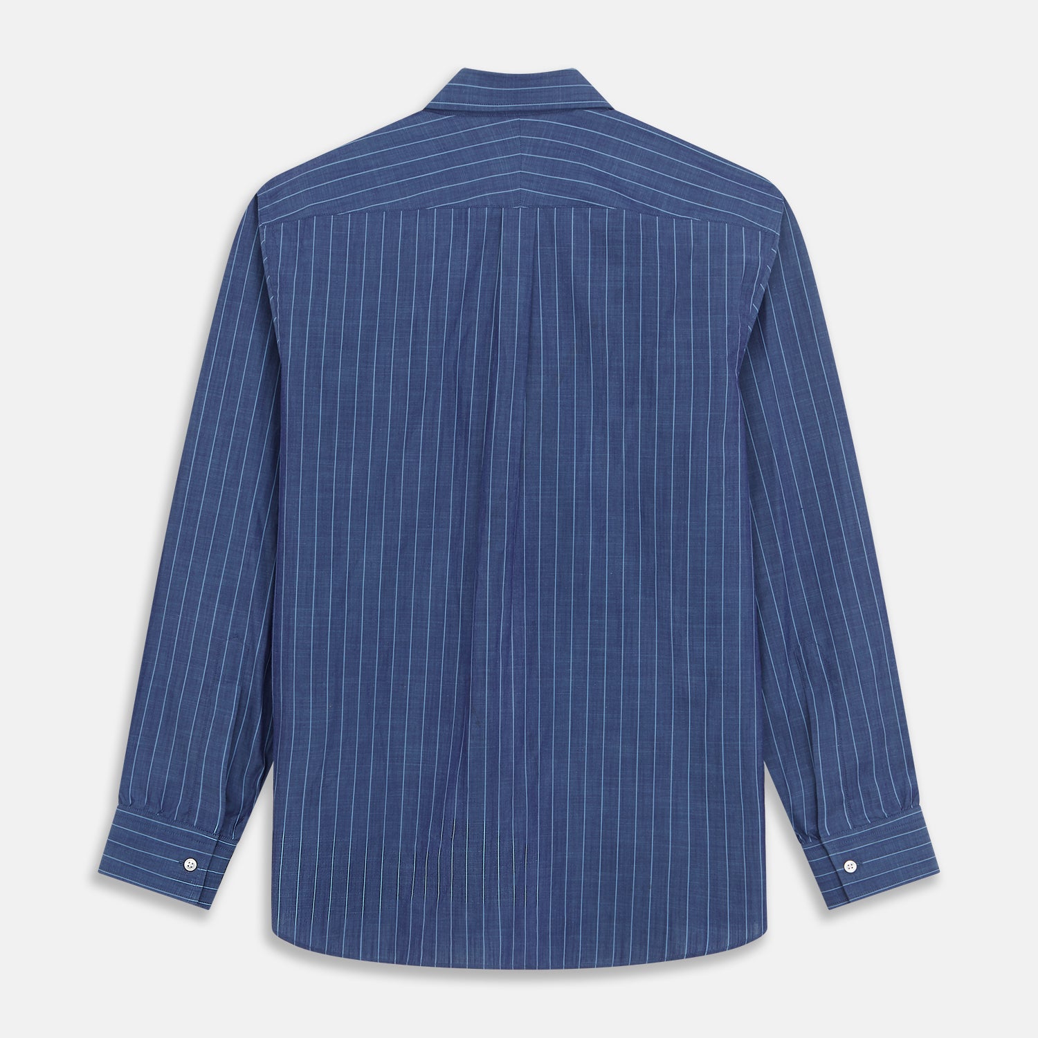 View 6 of product Close-up of a person wearing the Turnbull & Asser Blue Stripe Weekend Fit Nevis Shirt with Derby Collar and 1-Button Cuffs under a dark pinstripe blazer, focusing on the collar and upper chest. The face is partially out of frame.