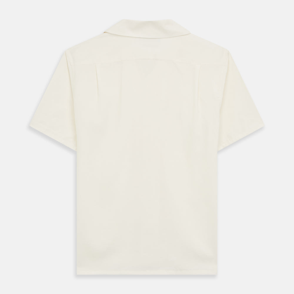 The Turnbull & Asser Cream Holiday Fit Silk Phillips Shirt features a revere collar, short sleeves, and three front pockets, shown flat on a white background.