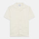 The Turnbull & Asser Cream Holiday Fit Silk Phillips Shirt features a revere collar, short sleeves, and three front pockets, shown flat on a white background.