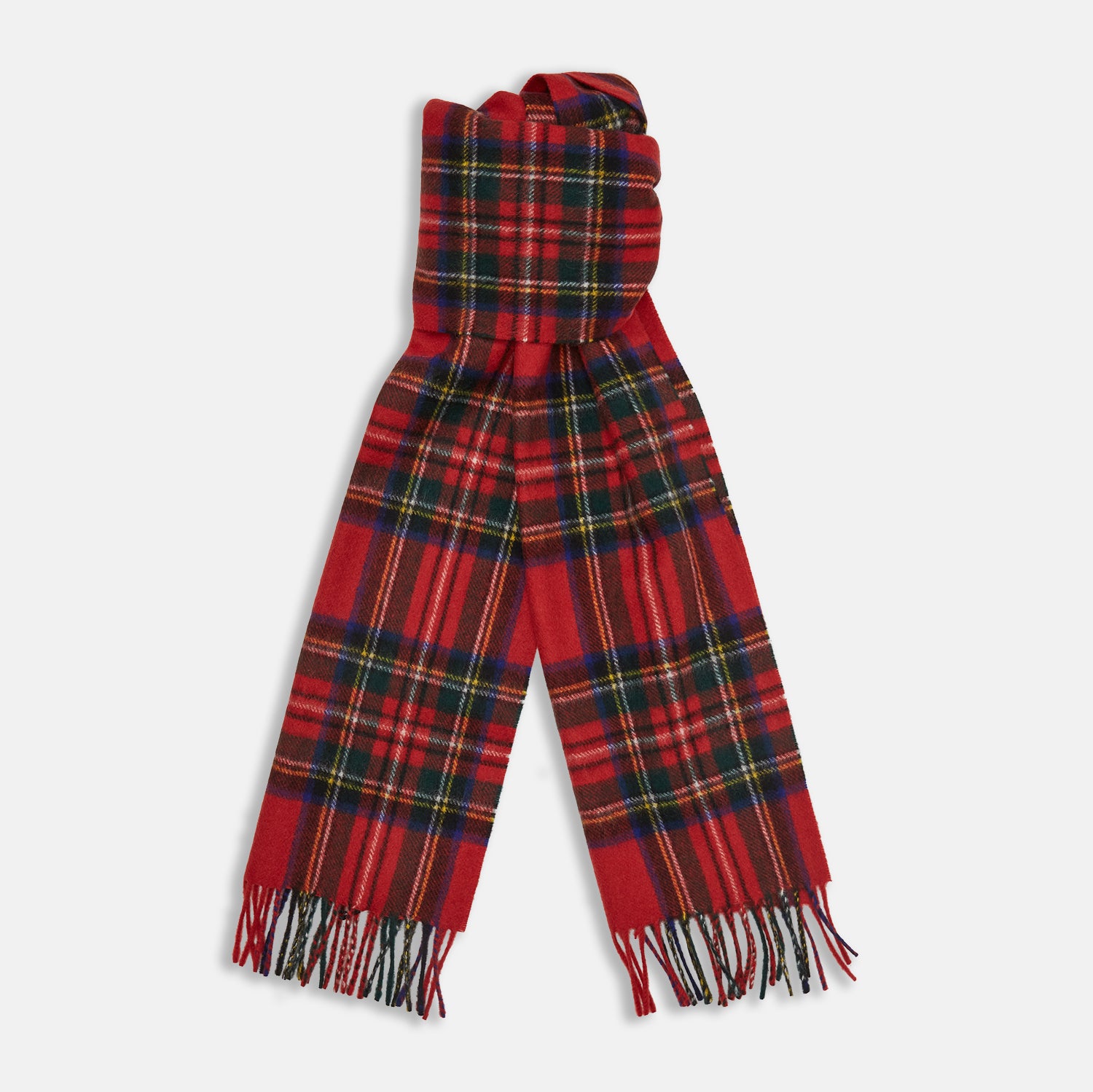 View 1 of product The Turnbull & Asser Royal Stewart Tartan Cashmere Scarf, showcasing a classic red plaid with black, yellow, and green accents and fringed ends, is displayed against a white background.
