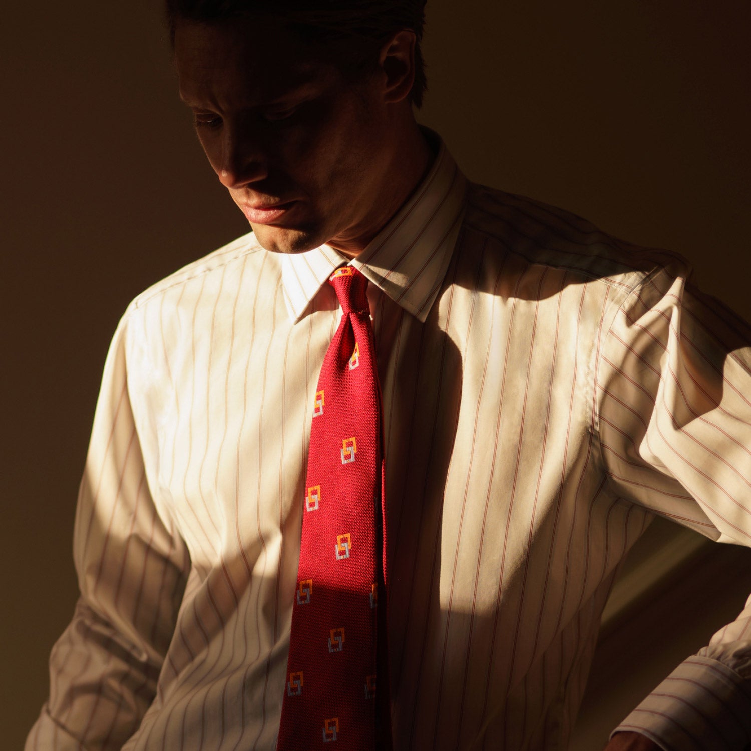 View 2 of product The Turnbull & Asser Red and Blue Multi-stripe Cotton Regular Fit Mayfair Shirt features a button-down front and classic collar, displayed on a plain white background.
