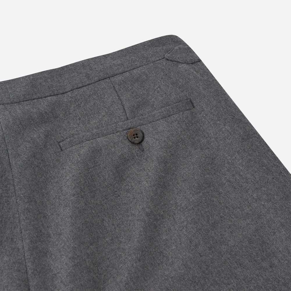 The Grey Fox Flannel Trousers by Turnbull & Asser are tailored in a straight-leg fit from soft wool flannel by Fox Brothers, featuring belt loops and side pockets, shown flat on a white background.