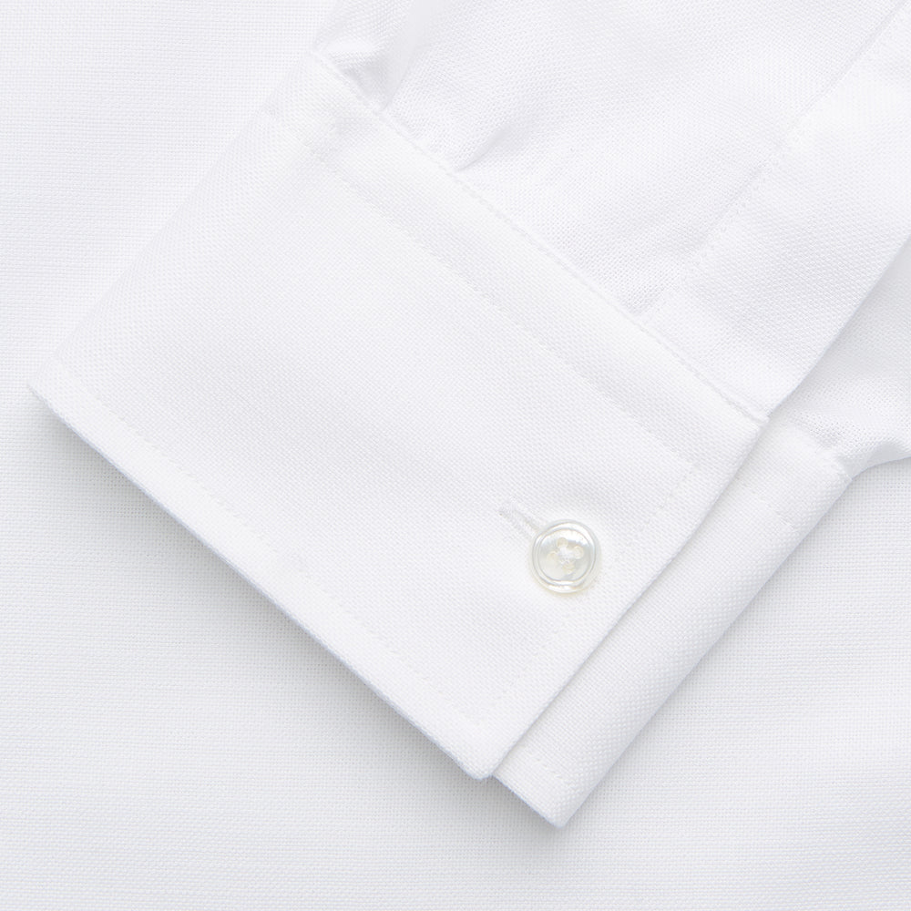 The Turnbull & Asser White Chambray Weekend Fit Shirt features a Dorset collar, 1-button cuffs, and a front pocket. Its clean design stands out against a plain white background—perfect for fans of classic Weekend Fit shirts.