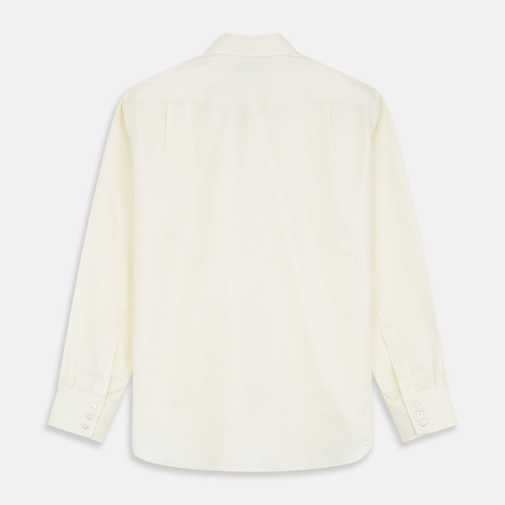 The Turnbull & Asser Cream Weekend Fit Larkin Shirt features a Dorset collar, 3-button cuffs, and two button-flap chest pockets in soft herringbone cotton, displayed flat on a white background.