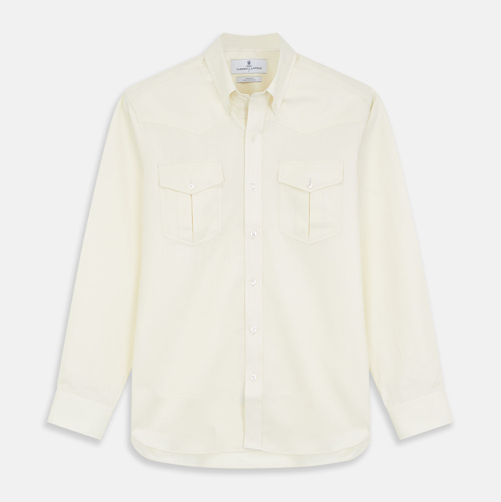 The Turnbull & Asser Cream Weekend Fit Larkin Shirt features a Dorset collar, 3-button cuffs, and two button-flap chest pockets in soft herringbone cotton, displayed flat on a white background.