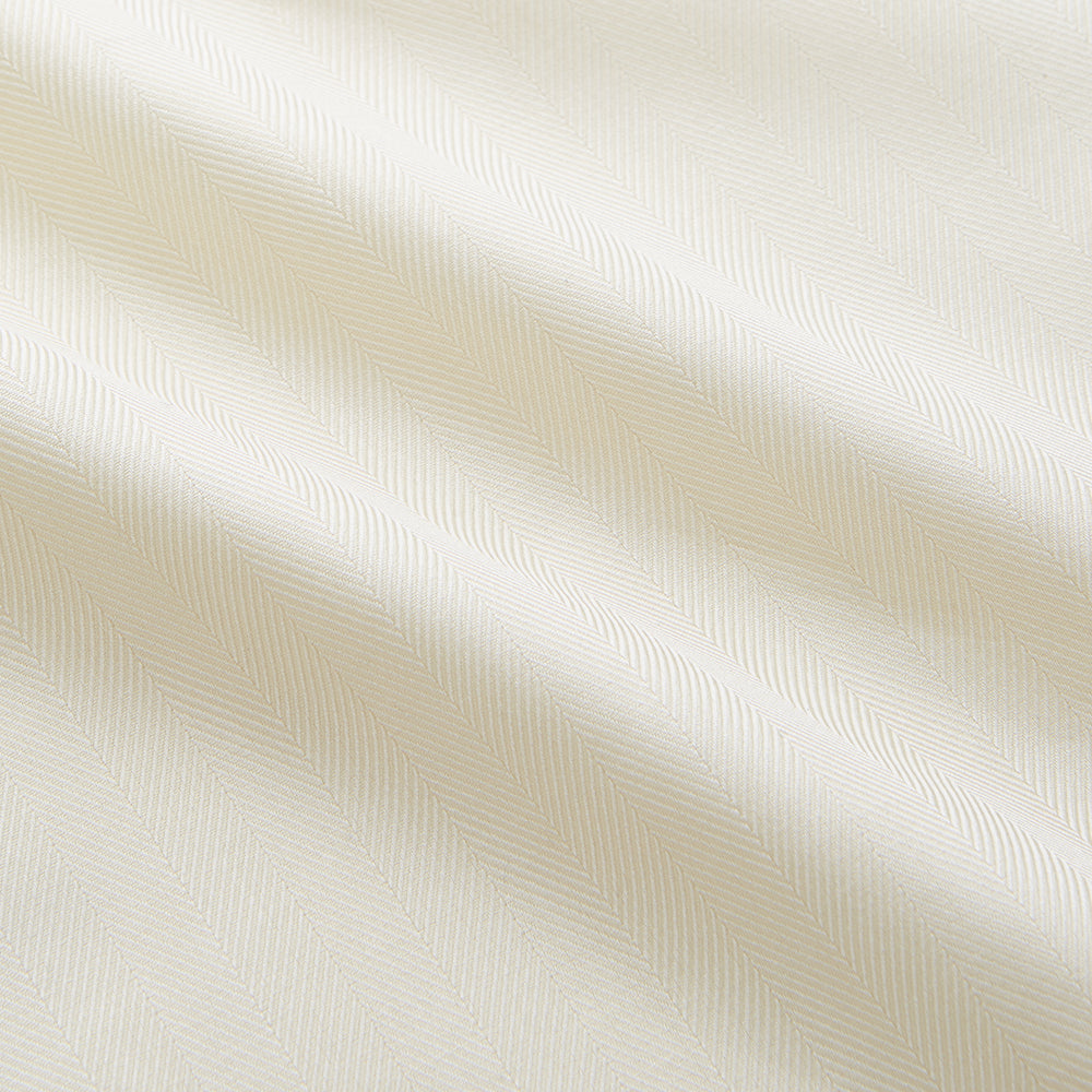 The Turnbull & Asser Cream Weekend Fit Larkin Shirt features a Dorset collar, 3-button cuffs, and two button-flap chest pockets in soft herringbone cotton, displayed flat on a white background.
