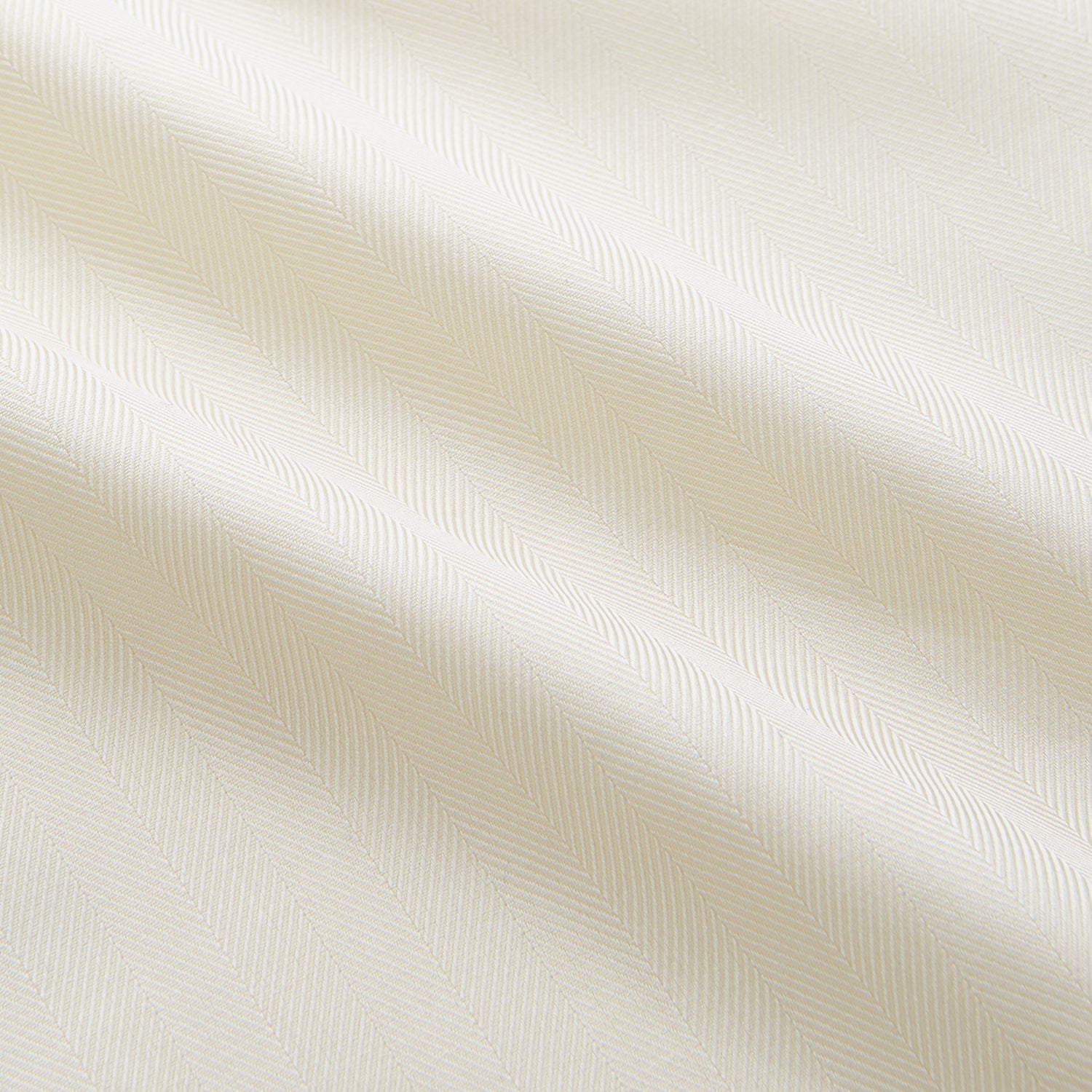 View 4 of product The Turnbull & Asser Cream Weekend Fit Larkin Shirt features a Dorset collar, 3-button cuffs, and two button-flap chest pockets in soft herringbone cotton, displayed flat on a white background.