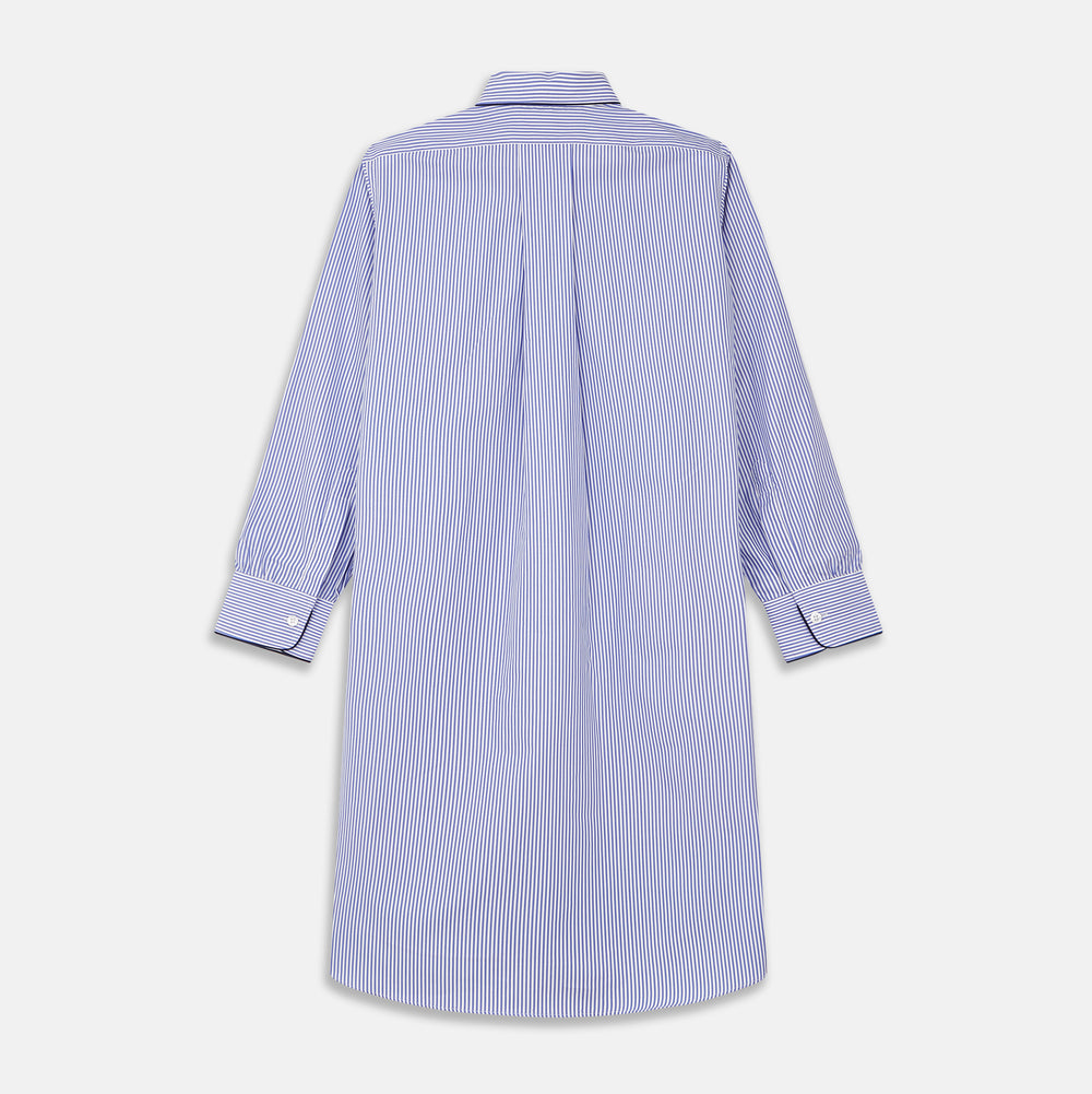 The Turnbull & Asser Blue Bengal Stripe Piped Cotton Nightshirt features long sleeves, a pointed collar, dark-trimmed pocket, curved hem, button details, and cuffed sleeves for an elegant look.
