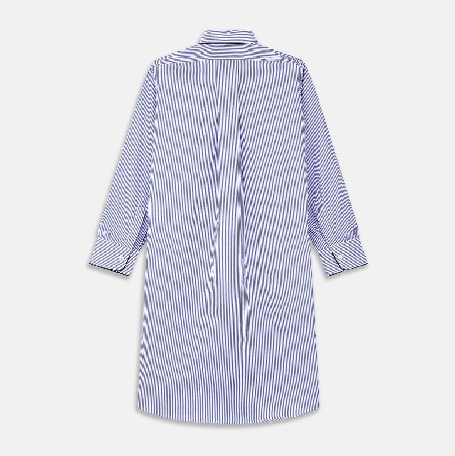 View 5 of product The Turnbull & Asser Blue Bengal Stripe Piped Cotton Nightshirt features long sleeves, a pointed collar, dark-trimmed pocket, curved hem, button details, and cuffed sleeves for an elegant look.