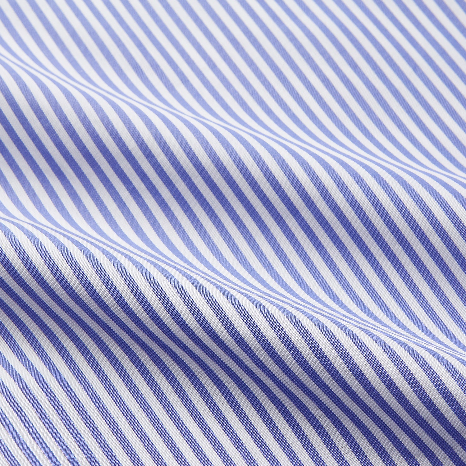 View 3 of product The Turnbull & Asser Blue Bengal Stripe Piped Cotton Nightshirt features long sleeves, a pointed collar, dark-trimmed pocket, curved hem, button details, and cuffed sleeves for an elegant look.