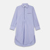 View 1 of product The Turnbull & Asser Blue Bengal Stripe Piped Cotton Nightshirt features long sleeves, a pointed collar, dark-trimmed pocket, curved hem, button details, and cuffed sleeves for an elegant look.