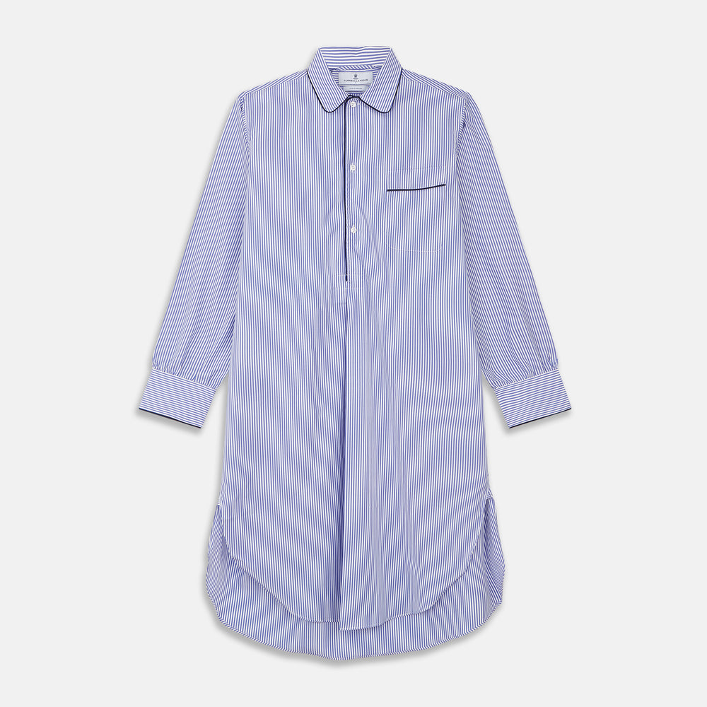 The Turnbull & Asser Blue Bengal Stripe Piped Cotton Nightshirt features long sleeves, a pointed collar, dark-trimmed pocket, curved hem, button details, and cuffed sleeves for an elegant look.