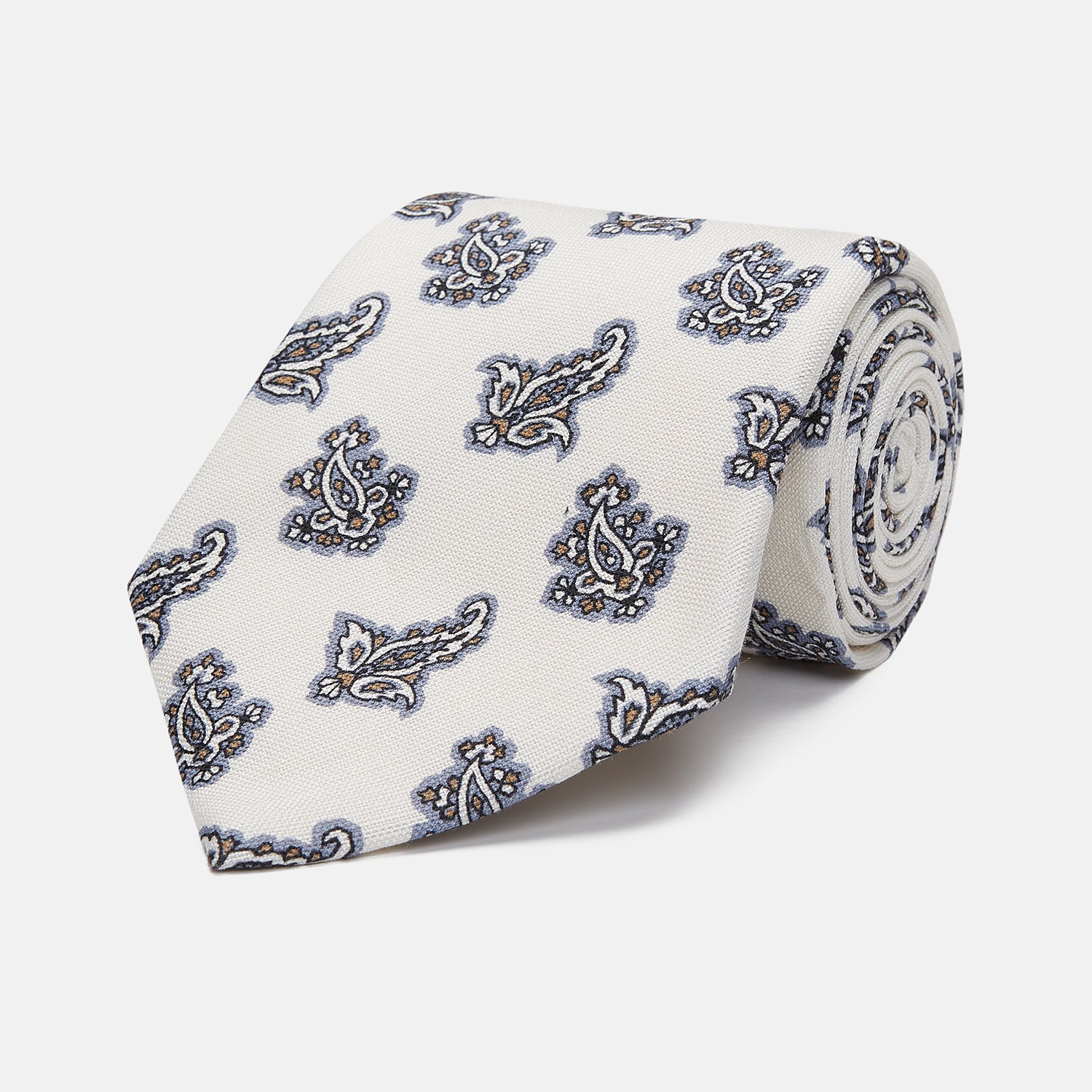 View 1 of product The Ecru Paisley Floral Cotton Silk Blend Tie by Turnbull & Asser features a paisley floral pattern, elegantly displayed and neatly rolled on a plain white background.