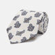 The Ecru Paisley Floral Cotton Silk Blend Tie by Turnbull & Asser features a paisley floral pattern, elegantly displayed and neatly rolled on a plain white background.