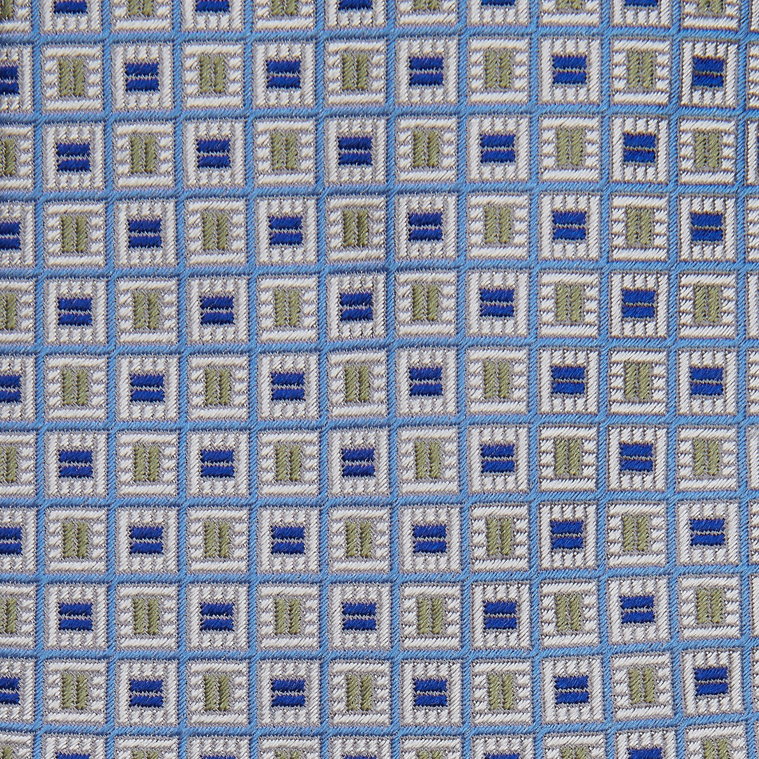 View 2 of product A Turnbull & Asser Blue and Yellow Geometric Silk Jacquard Tie is shown rolled up on a plain light background.