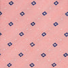 View 2 of product The Turnbull & Asser Pink Fine Square Slub Silk Tie features a pastel pink silk jacquard with blue and white geometric squares, shown rolled up on a plain white background.