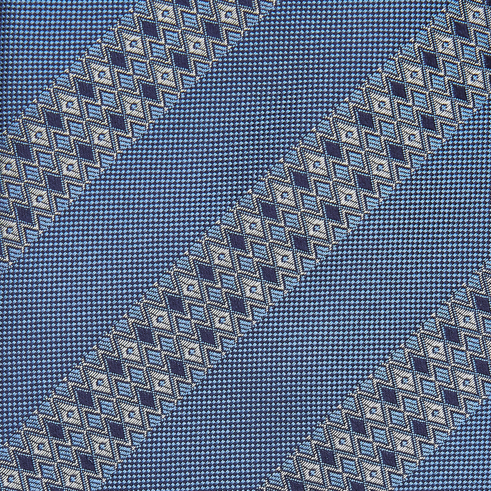 The Turnbull & Asser Dark Blue Baroque Stripe Silk Jacquard Tie, featuring elegant baroque stripes, is displayed rolled up on a white background.