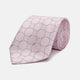 The Turnbull & Asser Baby Pink and Blue Circle Jacquard Silk Tie features a subtle geometric pattern, elegantly rolled against a plain white background.