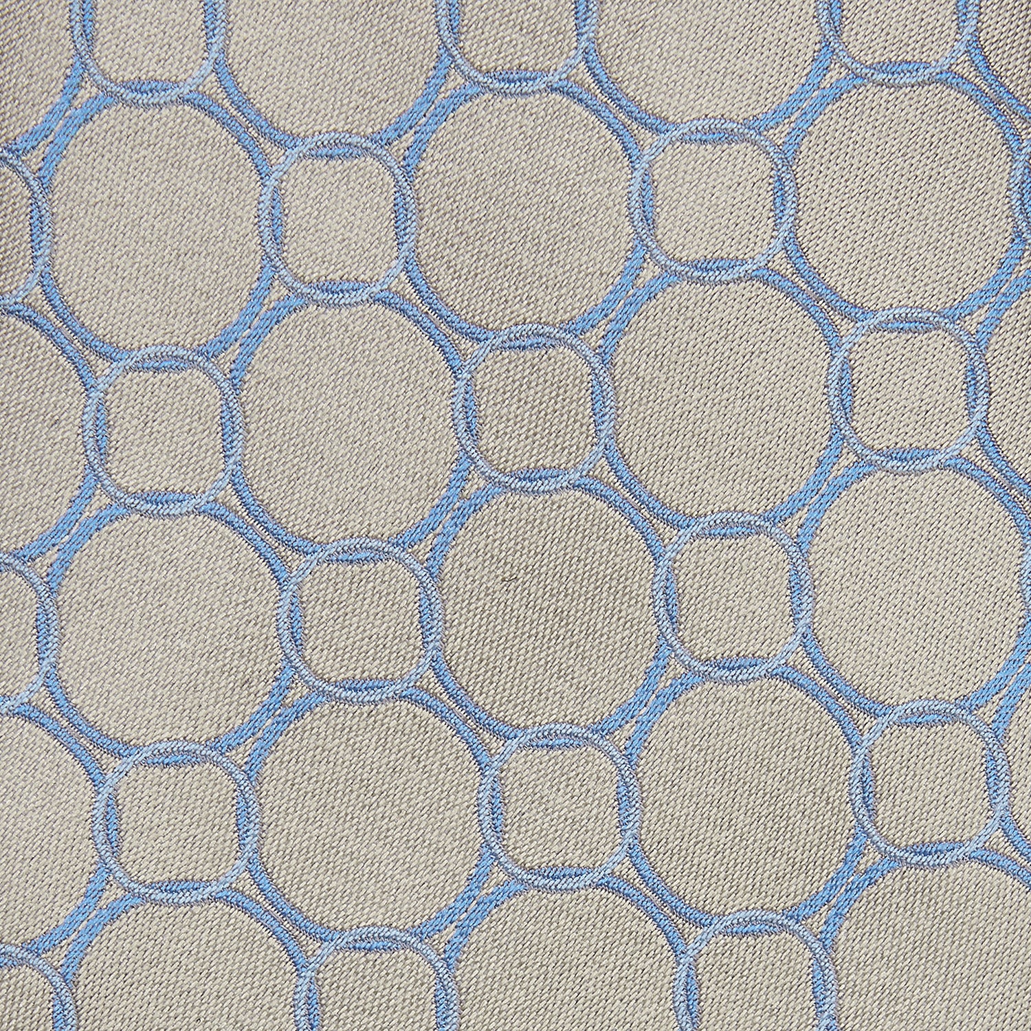 View 2 of product The Turnbull & Asser Toffee and Powder Blue Circle Jacquard Silk Tie, featuring an interlocking circular pattern, is rolled up and displayed on a plain white background.