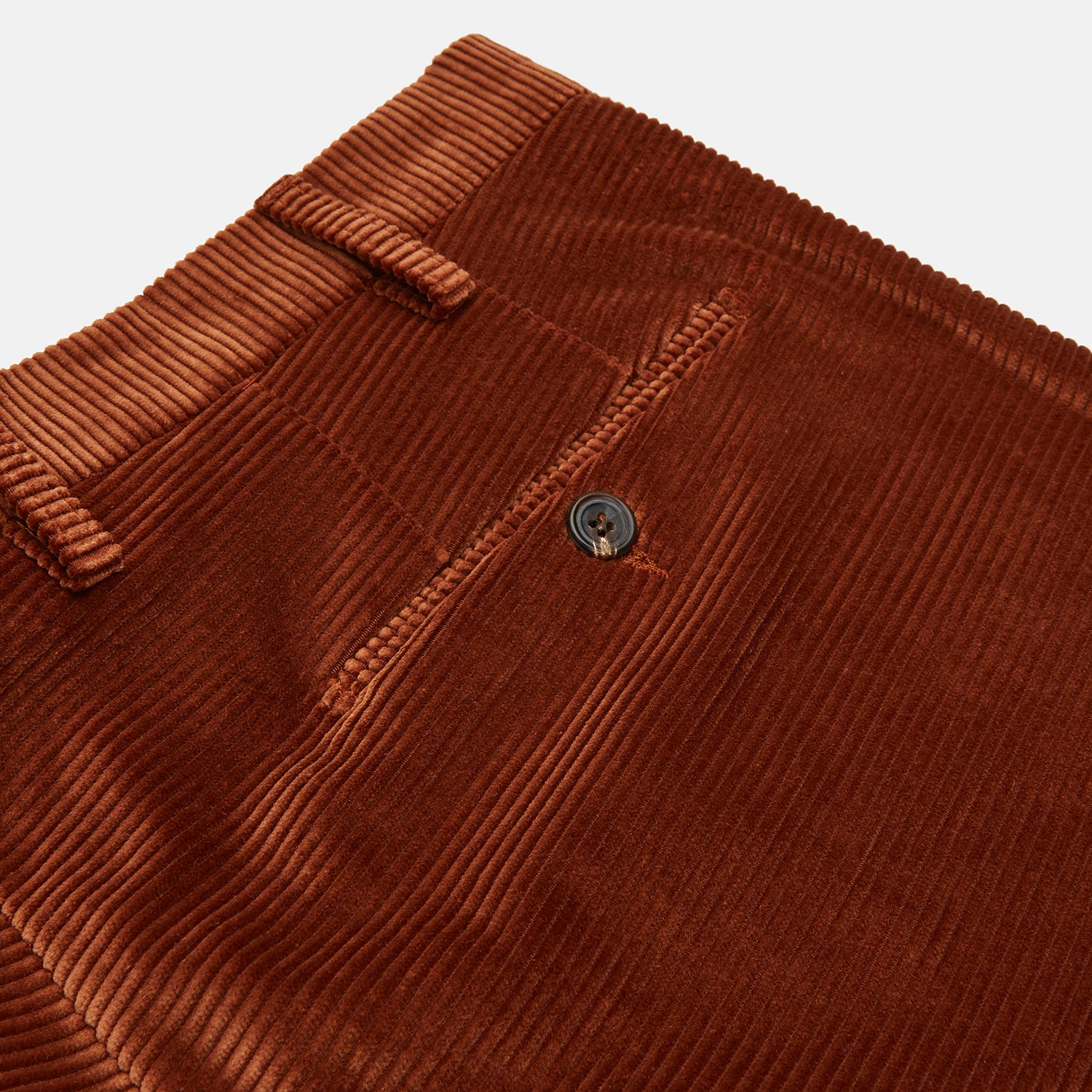 View 2 of product Turnbull & Asser’s Rust Horizontal Cord Trousers feature a straight-leg cut, front pockets, and button closure. Made from heavy-weight corduroy, these trousers are shown laid flat on a white background.