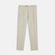 Turnbull & Asser's Stone Cotton Twill Pleated Trousers feature a relaxed fit, front pleats, side pockets, belt loops, and button closure, shown laid flat on a white background.