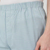 View 3 of product Kelly Green Check Modern Pyjama Trousers by Turnbull & Asser, crafted from superfine cotton with an elastic waistband for a modern look, shown against a plain white background.