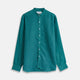 The Turnbull & Asser Teal Weekend Fit Long Sleeve Linen Shirt features a stand collar, 1-button cuffs, white buttons, and a relaxed fit, shown on a plain white background.