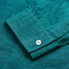 View 3 of product The Turnbull & Asser Teal Weekend Fit Long Sleeve Linen Shirt features a stand collar, 1-button cuffs, white buttons, and a relaxed fit, shown on a plain white background.