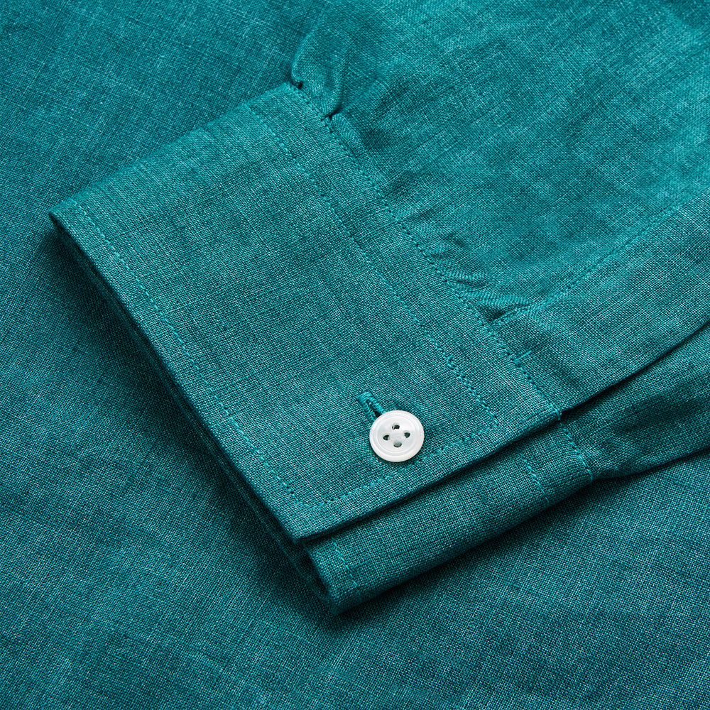 The Turnbull & Asser Teal Weekend Fit Long Sleeve Linen Shirt features a stand collar, 1-button cuffs, white buttons, and a relaxed fit, shown on a plain white background.