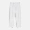 View 1 of product Turnbull & Asser’s White Cotton Pleated Trousers, a summer classic, are elegantly displayed against a crisp white backdrop.