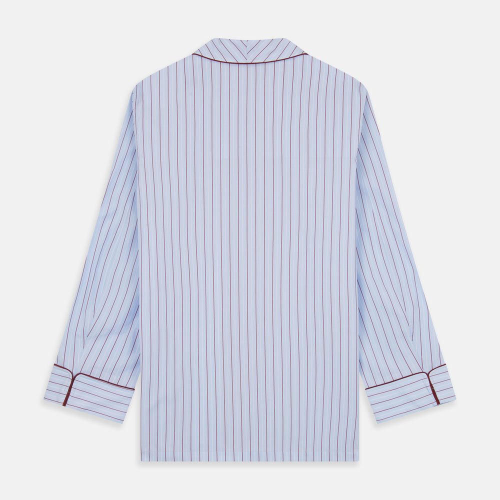 The Turnbull & Asser Burgundy Stripe Classic Pyjama Set features long sleeves, a button-up top with red piping, matching drawstring pants, and a traditional fit. Laid flat, it's luxury loungewear in signature burgundy stripes.
