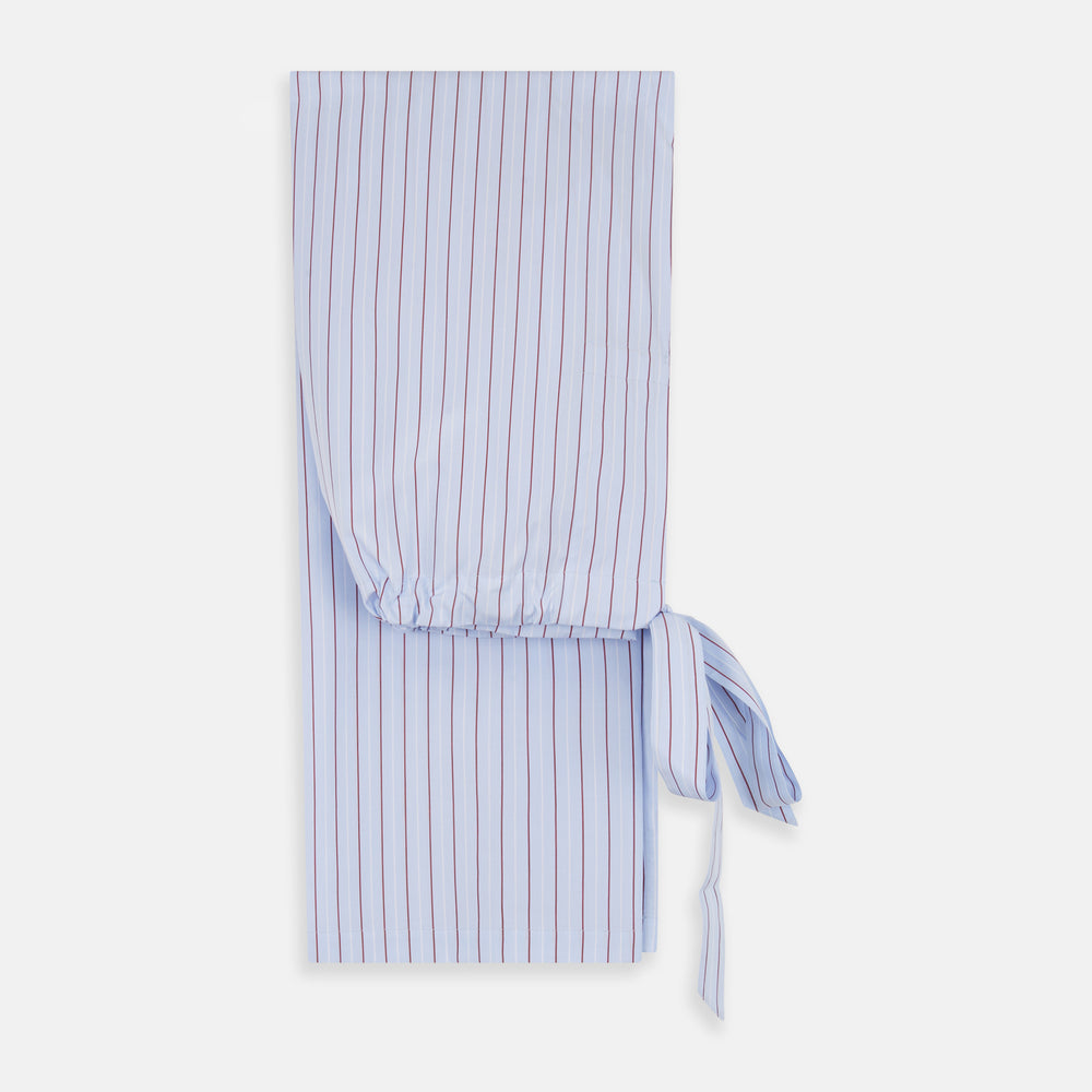 The Turnbull & Asser Burgundy Stripe Classic Pyjama Set features long sleeves, a button-up top with red piping, matching drawstring pants, and a traditional fit. Laid flat, it's luxury loungewear in signature burgundy stripes.