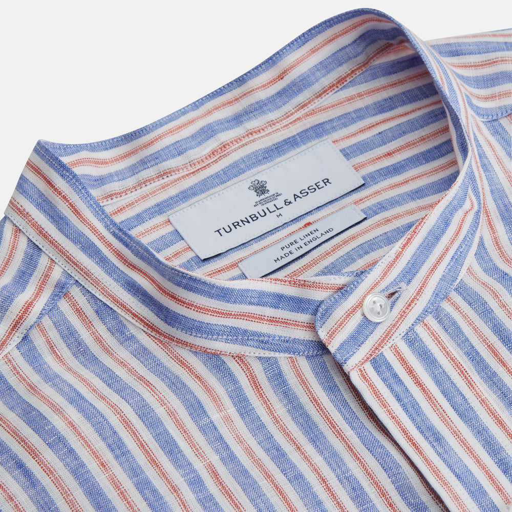 The Turnbull & Asser Blue & Red Linen Stripe Weekend Fit Shirt features a stand collar, vertical stripes, and two chest pockets with button flaps—perfect for casual style.