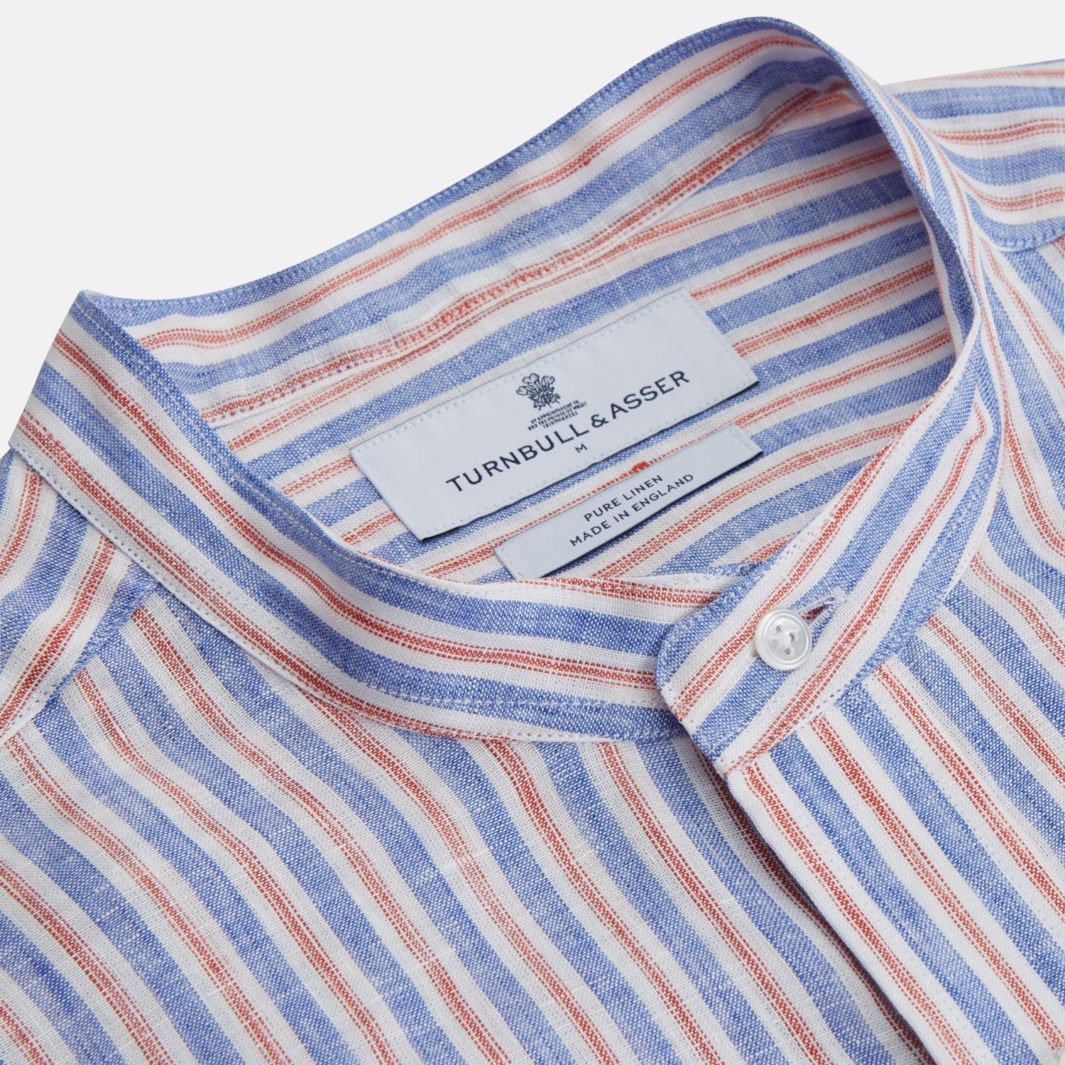 View 2 of product The Turnbull & Asser Blue & Red Linen Stripe Weekend Fit Shirt features a stand collar, vertical stripes, and two chest pockets with button flaps—perfect for casual style.