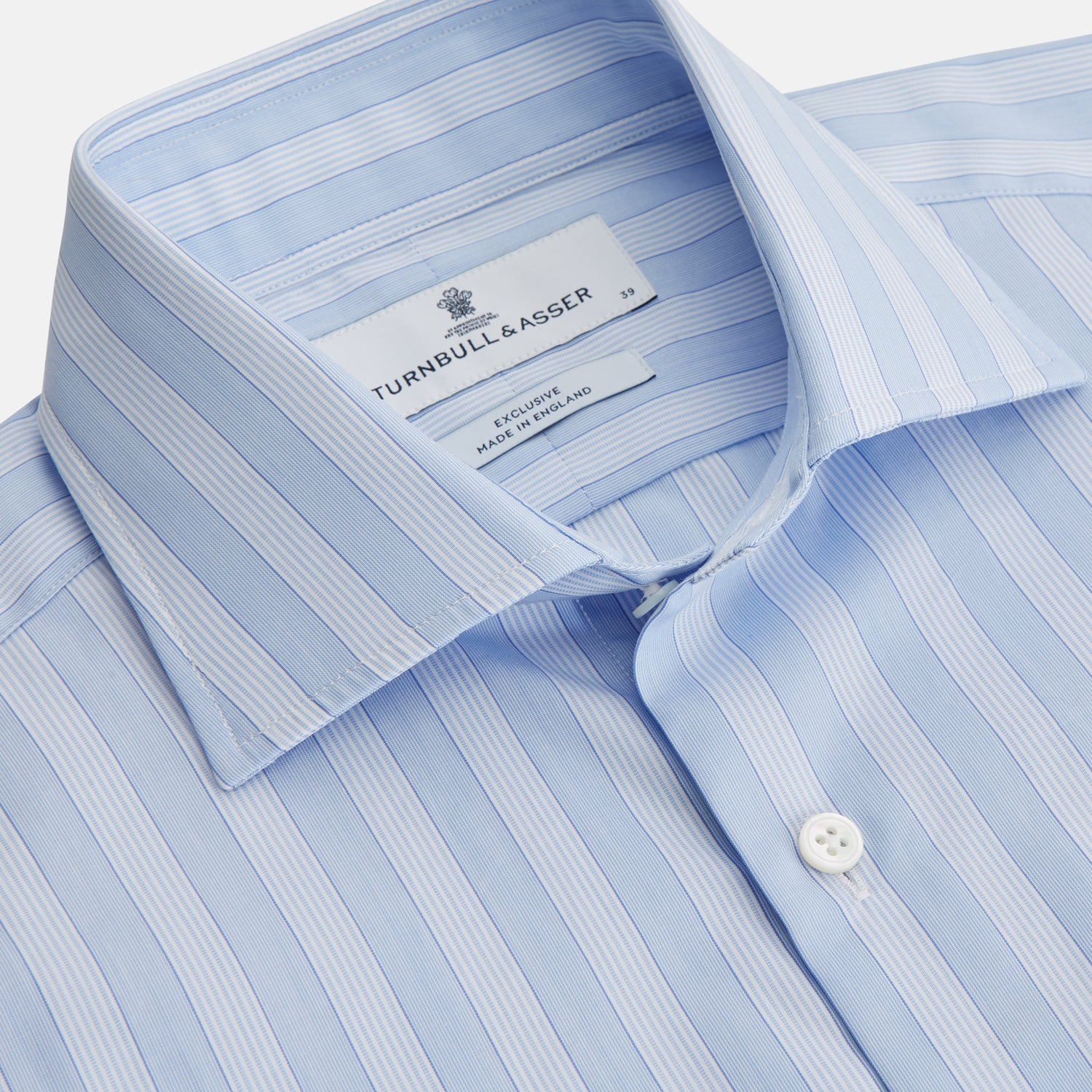 View 2 of product The Turnbull & Asser Tonal Blue Stripe Tailored Fit Shirt with Kent Collar features long sleeves and a button-up front, shown laid flat against a white background.