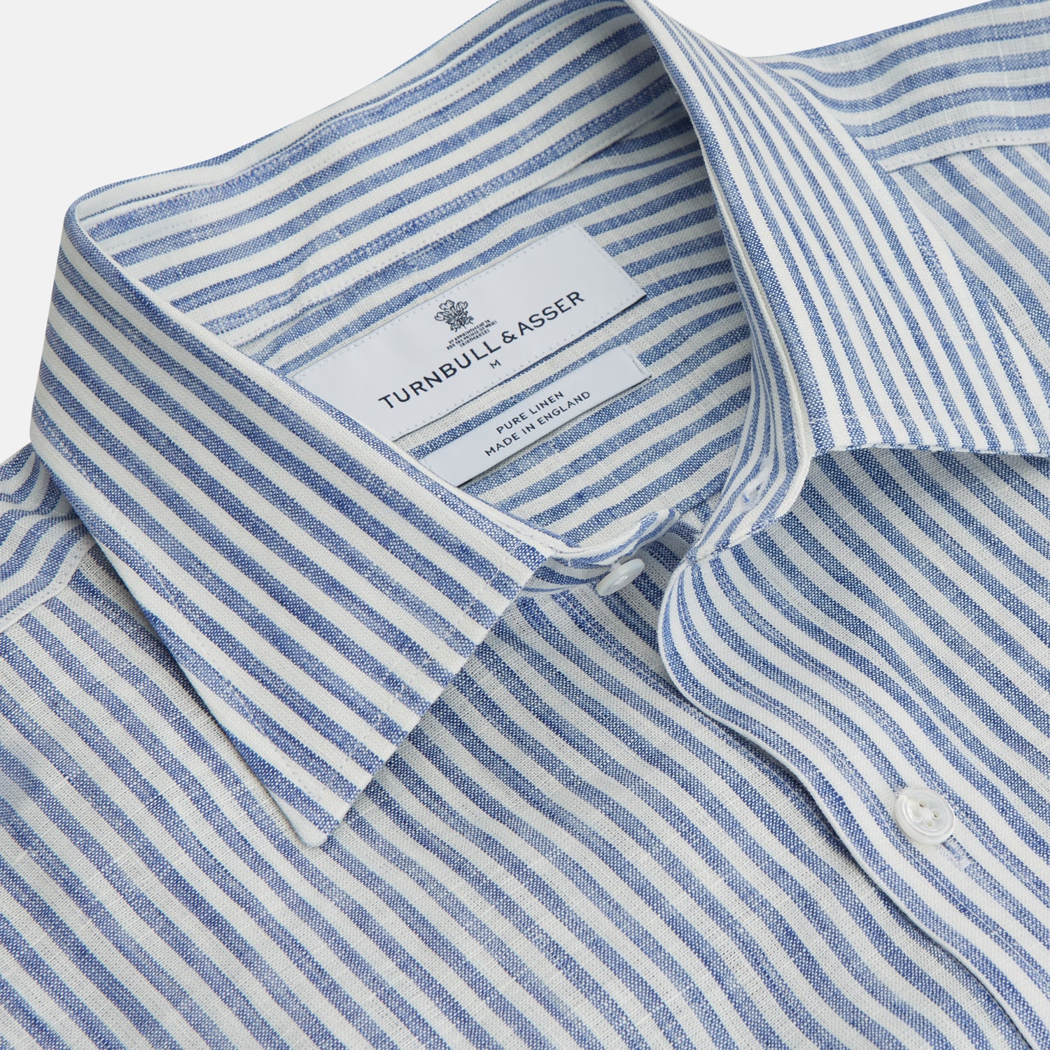 View 3 of product The Turnbull & Asser Sky Blue Linen Stripe Weekend Fit Shirt features blue and white vertical stripes, a Derby collar, and buttoned cuffs—ideal for pairing with classic cotton suits or other Weekend Fit shirts.