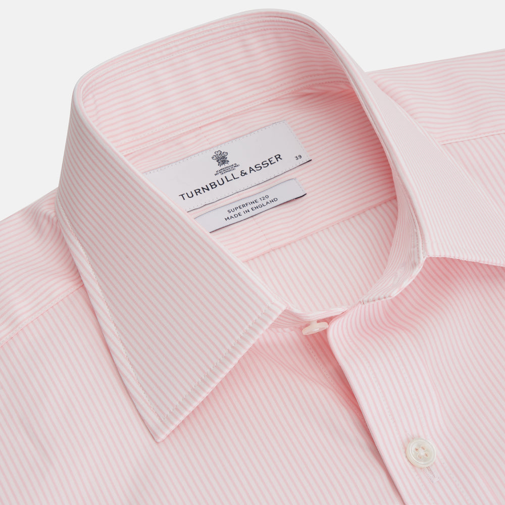 The Pink Fine Stripe Regular Fit Shirt with T&A Collar by Turnbull & Asser is a light pink, long-sleeve poplin shirt made from Italian cotton, featuring white buttons and shown flat on a white background.