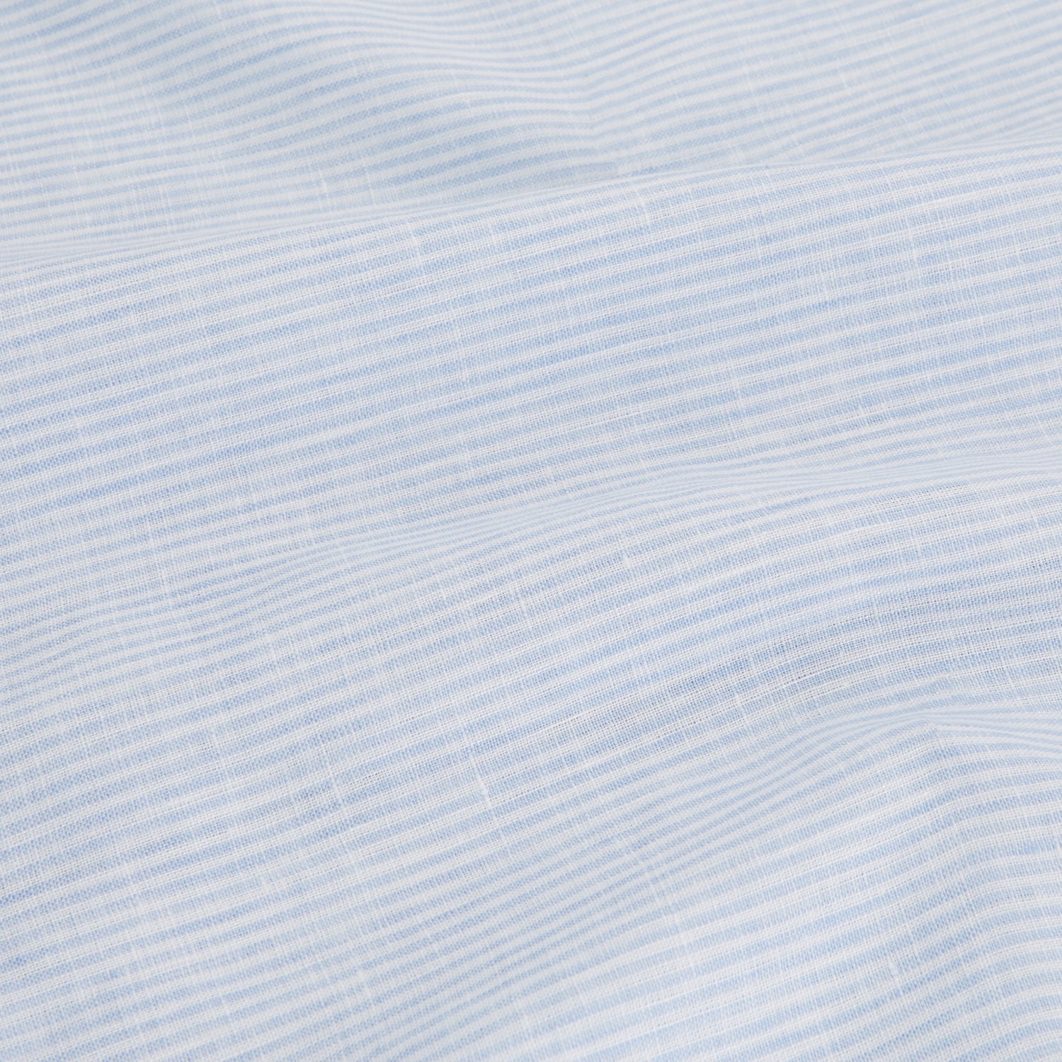 View 4 of product The Turnbull & Asser Blue Linen Stripe Holiday Fit Shirt features short sleeves, a revere collar, and single chest pocket, perfect for resort wear. Shown on a plain white background.