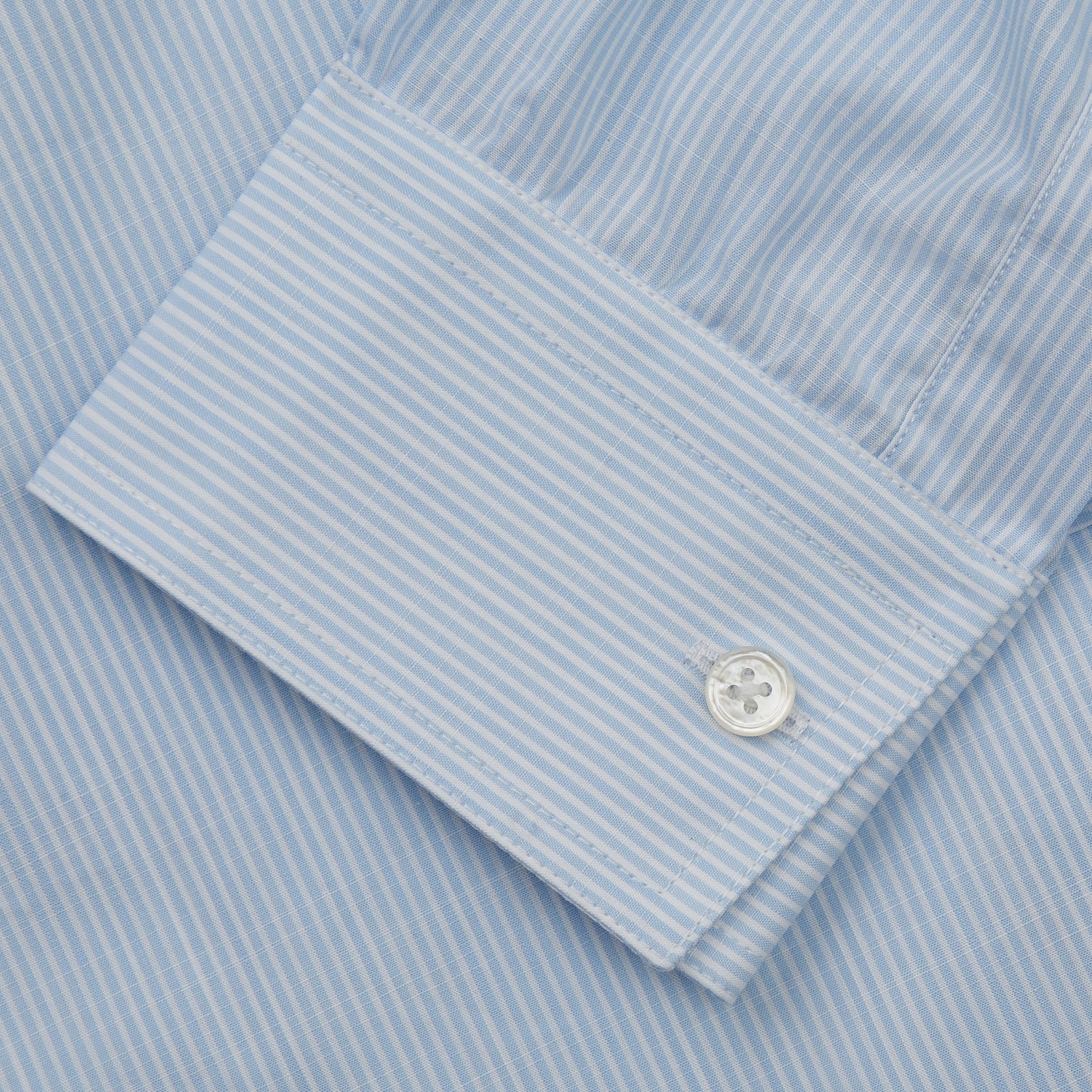 View 3 of product The Turnbull & Asser Sky Blue Chambray Stripe Weekend Fit Shirt features a Dorset collar, long sleeves, and two button-flap chest pockets, offering a relaxed look. Displayed on a plain white background.