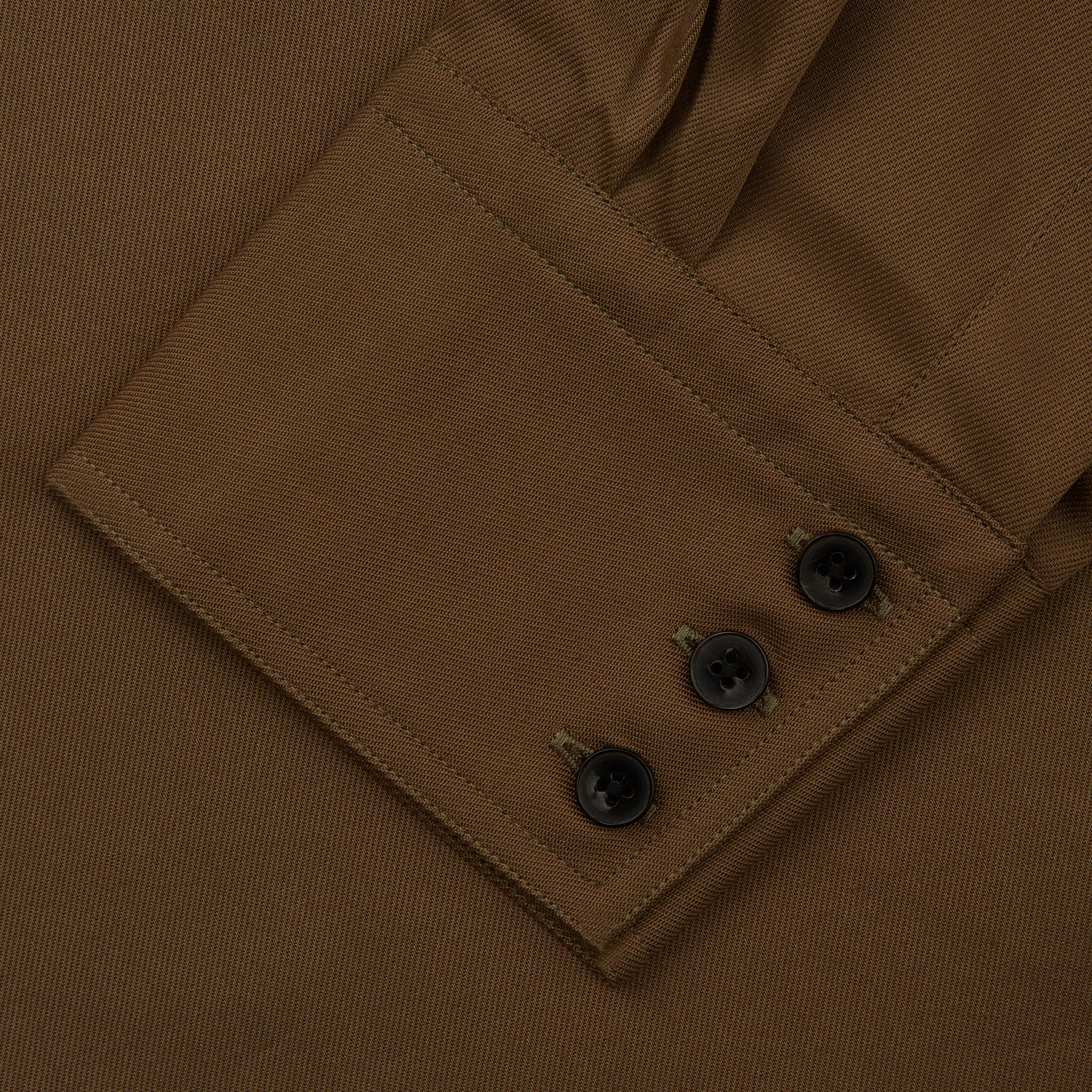 View 3 of product The Turnbull & Asser Khaki Cotton Weekend Fit Western Shirt features a Dorset collar, long sleeves, two button-flap chest pockets, and buttoned cuffs—an essential smart-casual piece shown against a white background.