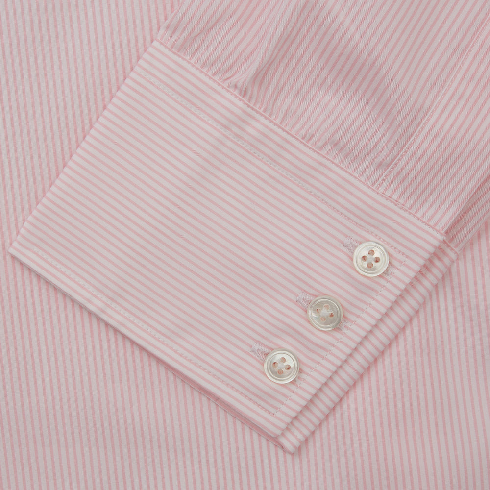 The Pink Fine Stripe Regular Fit Shirt with T&A Collar by Turnbull & Asser is a light pink, long-sleeve poplin shirt made from Italian cotton, featuring white buttons and shown flat on a white background.